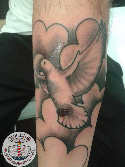 dove on the arm tattoo